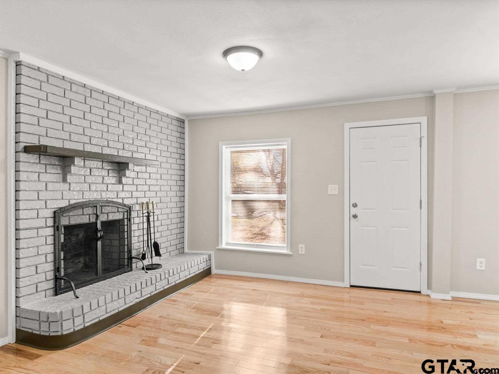 406 Giles Street Mineola, TX 75773 - Photo 4 of 19 a view of a livingroom with a fireplace and window
