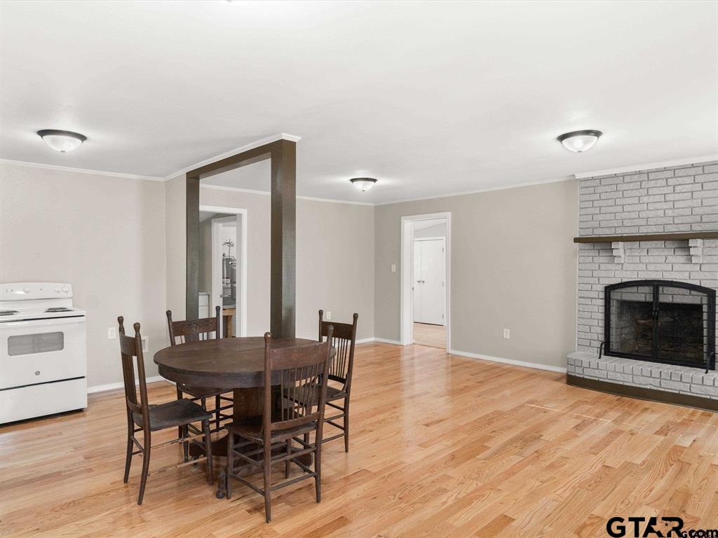 406 Giles Street Mineola, TX 75773 - Photo 6 of 19 a view of a dining room with furniture and wooden floor