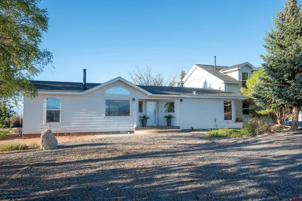a view of a house and a yard