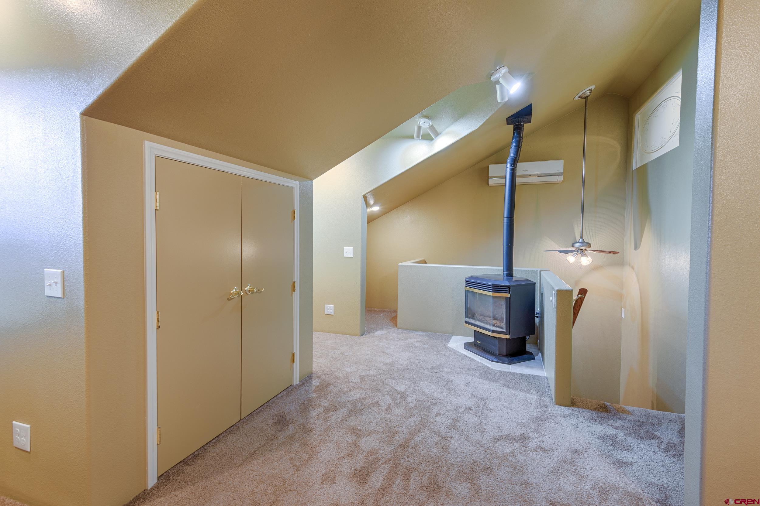 61928 Jay Jay Road Montrose, CO 81401 - Photo 21 of 36 a view of a hallway with storage and utility