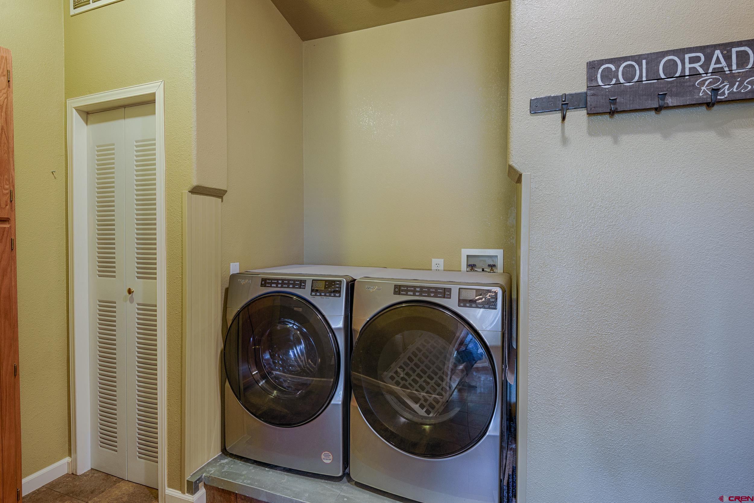 61928 Jay Jay Road Montrose, CO 81401 - Photo 25 of 36 a utility room with dryer and washer
