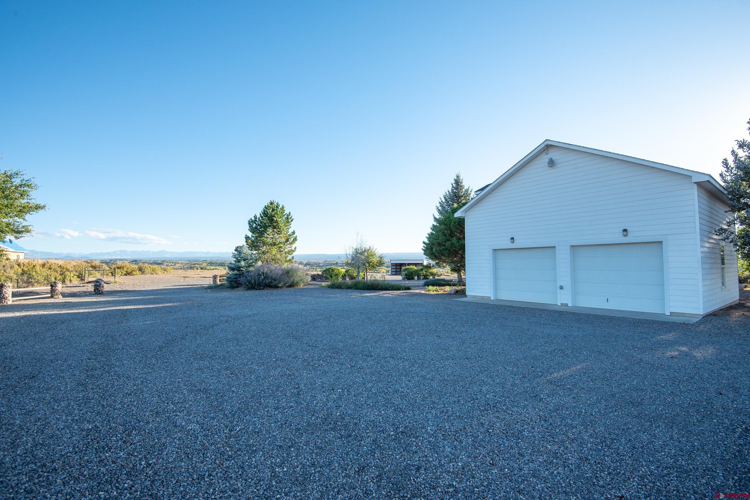 61928 Jay Jay Road Montrose, CO 81401 - Photo 32 of 36 a view of a big room with a yard