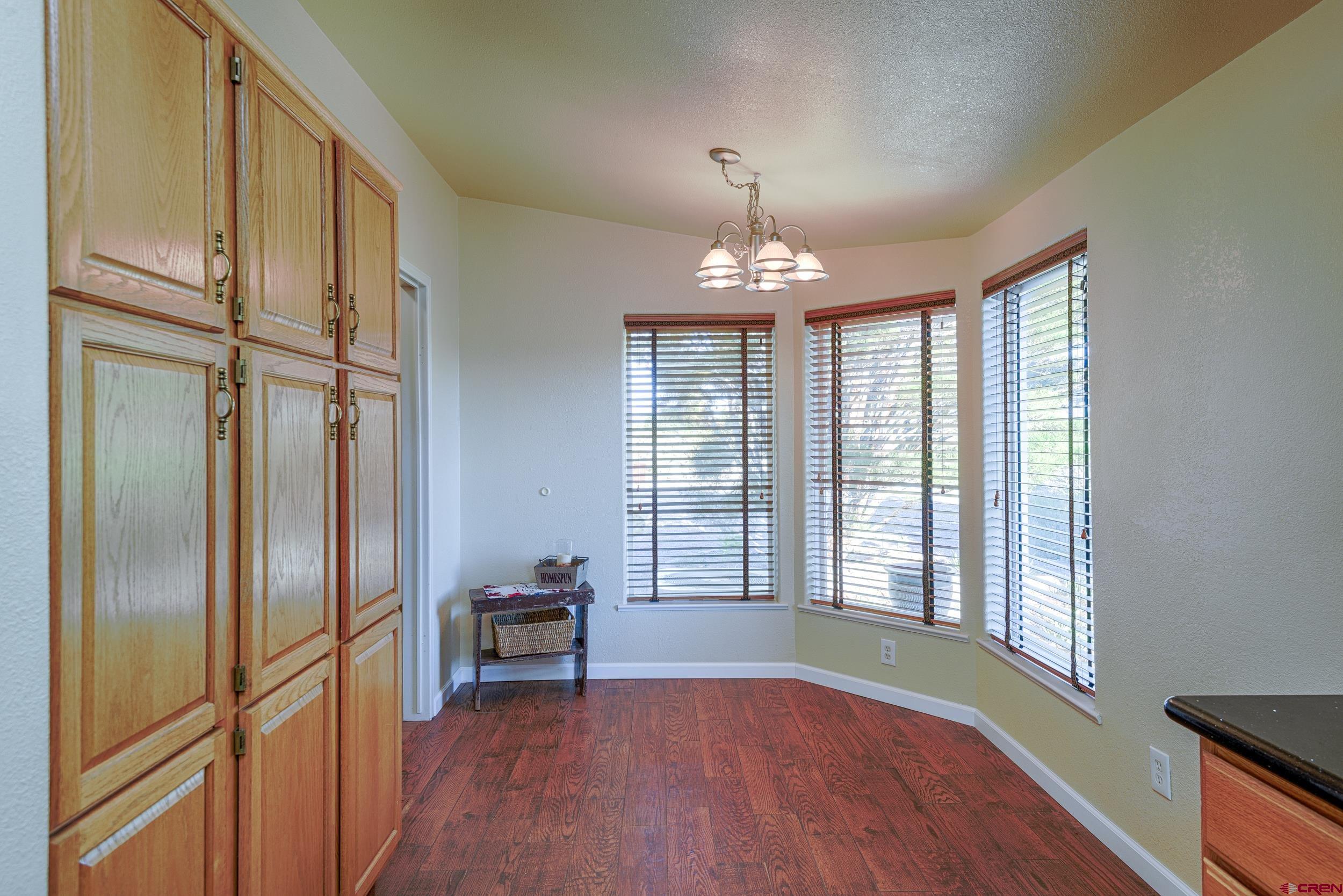 61928 Jay Jay Road Montrose, CO 81401 - Photo 9 of 36 a view of livingroom with furniture and chandelier fan