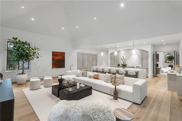 a large kitchen with stainless steel appliances granite countertop a stove and a refrigerator