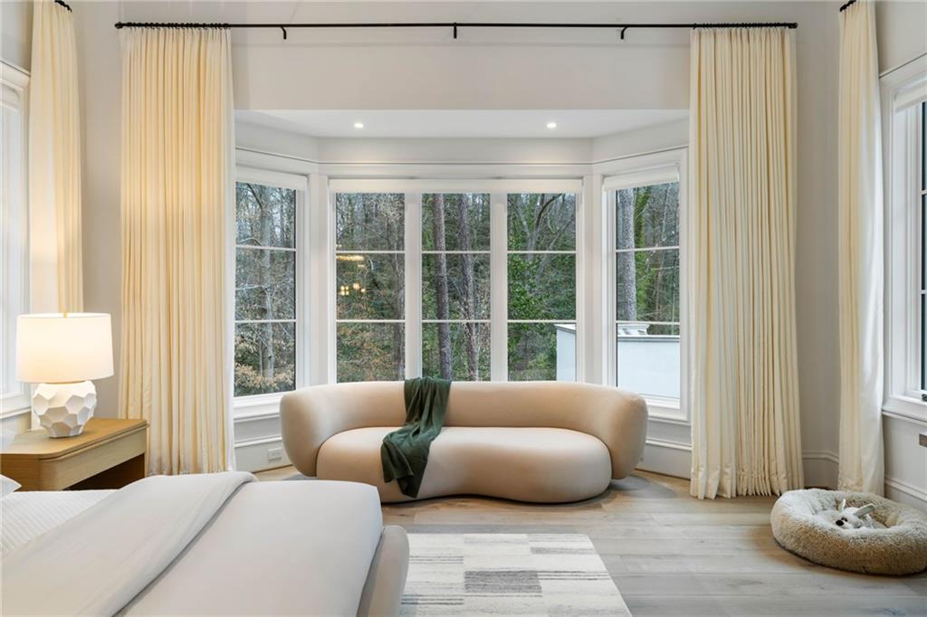 5245 Kenbrook Way Northwest Sandy Springs, GA 30327 - Photo 39 of 100 a bedroom with furniture and a large window