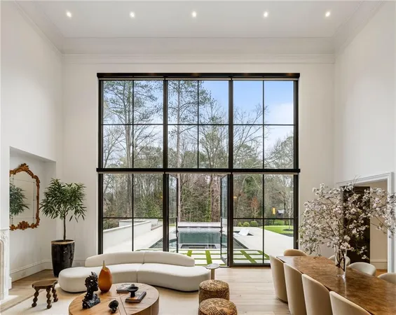 a living room with furniture and kitchen view