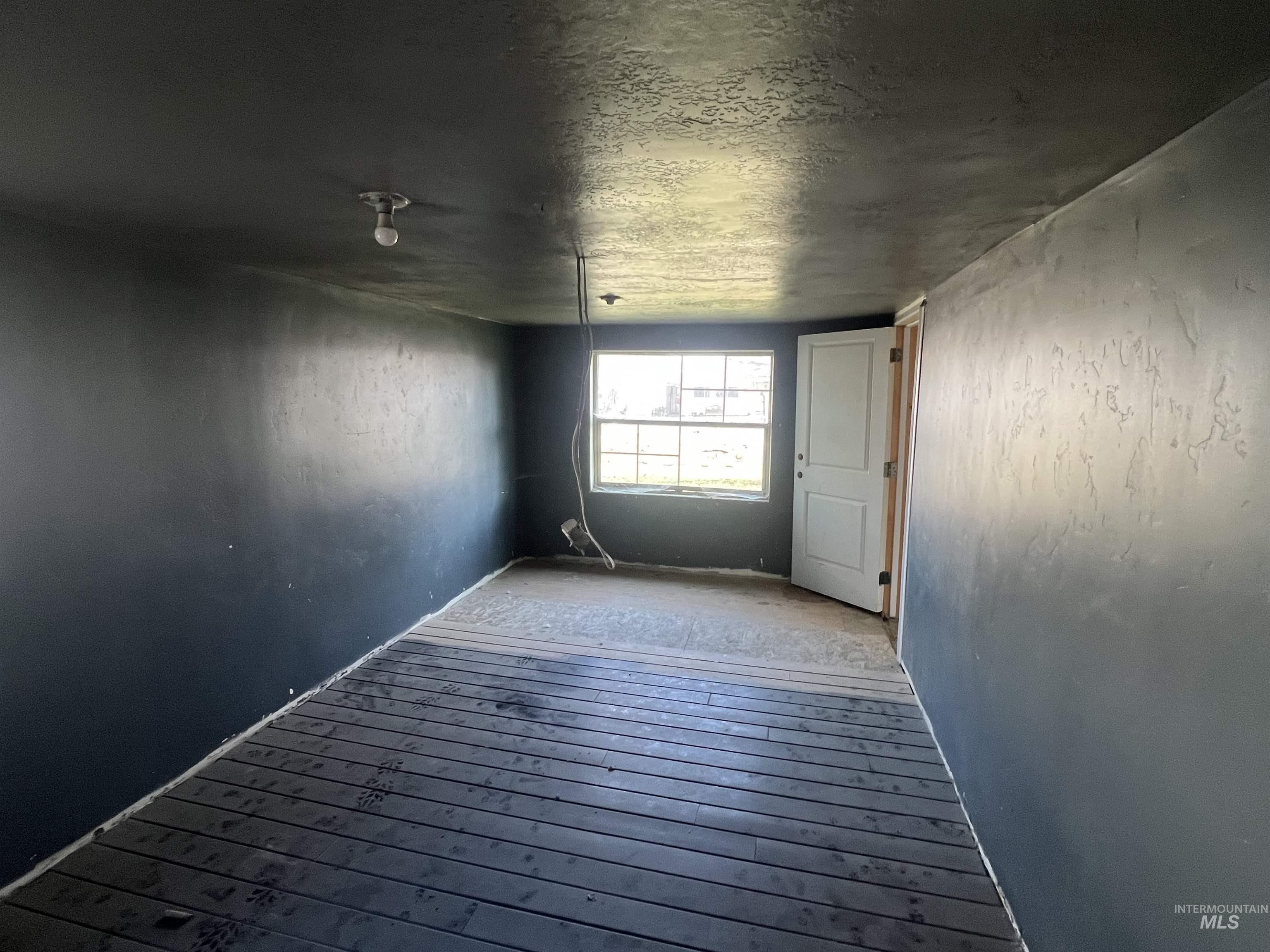 717 North 3rd Street Nyssa, OR 97913 - Photo 4 of 12 Unfurnished room featuring hardwood / wood-style flooring