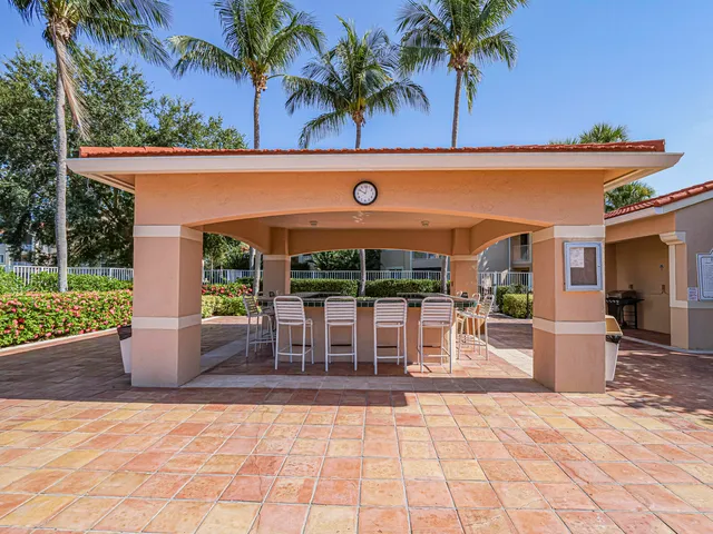 a view of a chairs and table in patio of the house