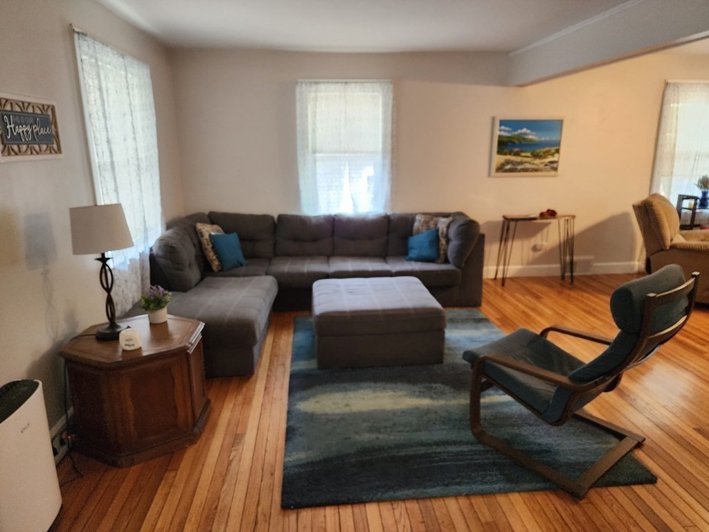 67 Sylvan Road Lancaster, MA 01523 - Photo 11 of 33 a living room with furniture a bed and a window