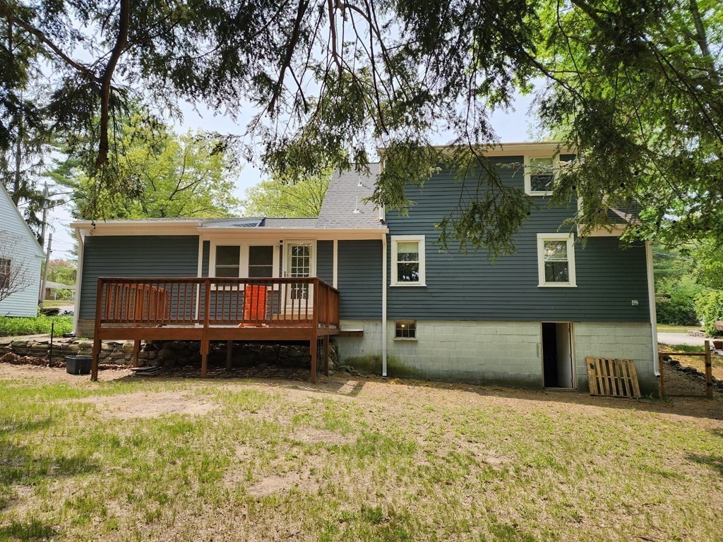 67 Sylvan Road Lancaster, MA 01523 - Photo 2 of 33 front view of a house with a yard