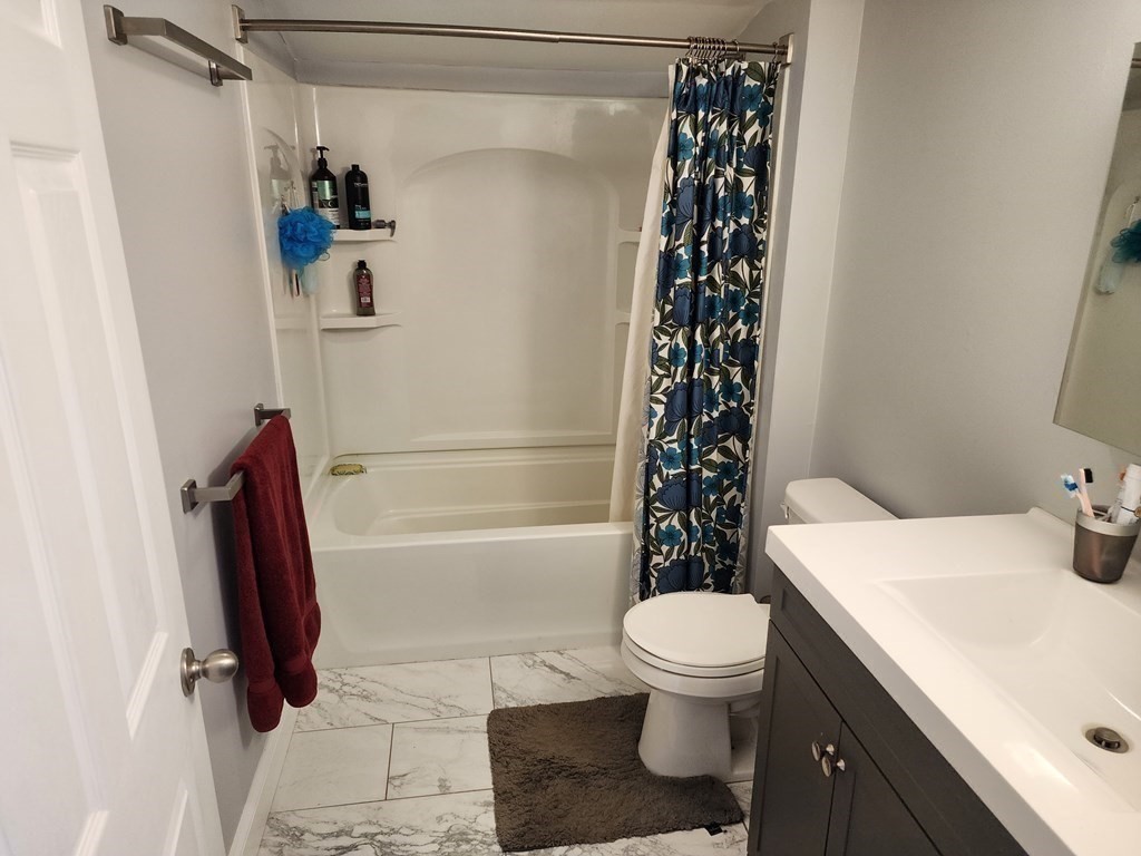 67 Sylvan Road Lancaster, MA 01523 - Photo 23 of 33 a bathroom with a sink toilet and shower