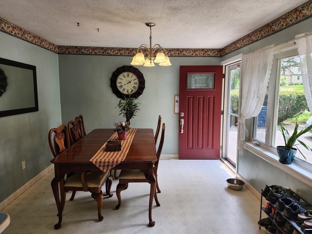 67 Sylvan Road Lancaster, MA 01523 - Photo 9 of 33 a view of a dining room with furniture window and wooden floor