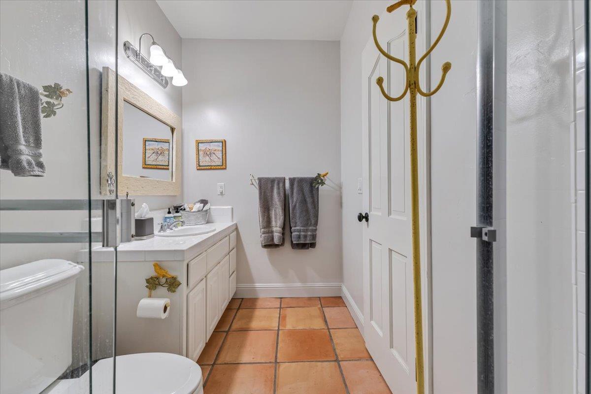 2727 Thomas Road Hollister, CA 95023 - Photo 60 of 83 a bathroom with a sink a toilet and shower