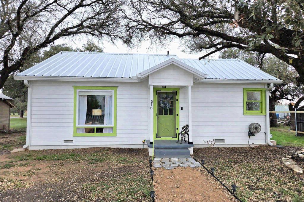 313 King Street Eden, TX 76837 - Photo 1 of 24 a front view of a house with garden
