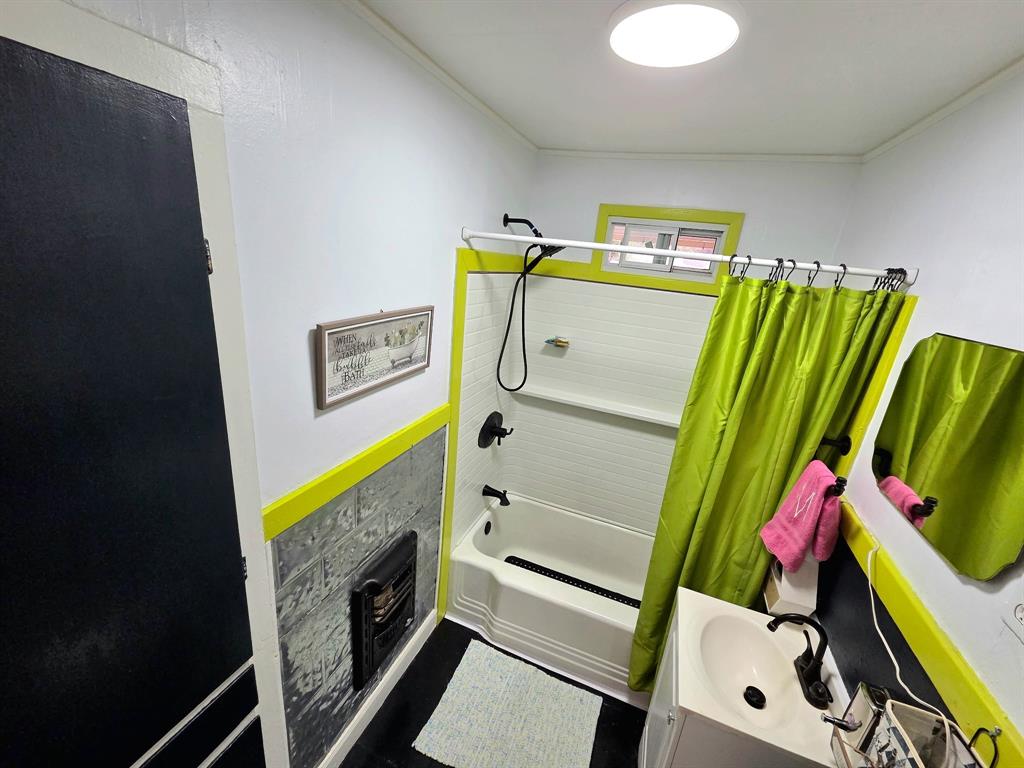 313 King Street Eden, TX 76837 - Photo 14 of 24 a bathroom with a sink mirror and vanity