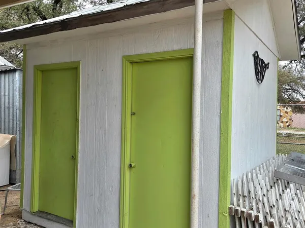 a view of a backyard with sitting area
