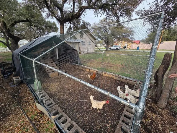 a view of a house with backyard porch and sitting area