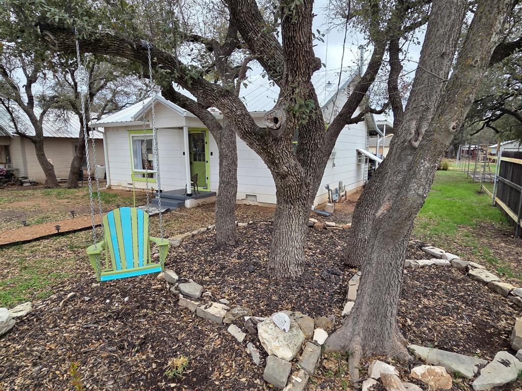 313 King Street Eden, TX 76837 - Photo 21 of 24 a view of a house with a yard and roof