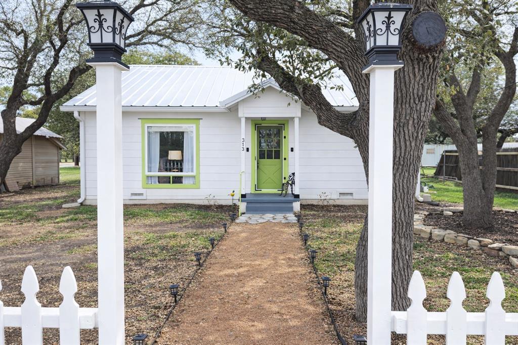 313 King Street Eden, TX 76837 - Photo 23 of 24 a view of a house with a yard