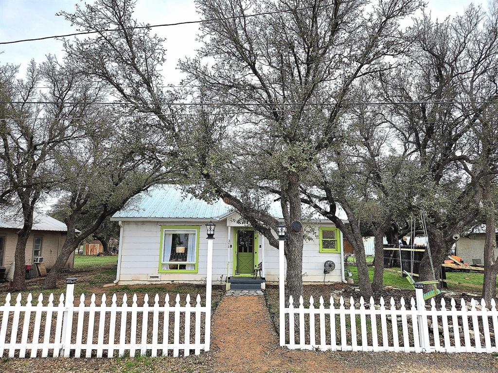 313 King Street Eden, TX 76837 - Photo 24 of 24 a front view of a house with a garden