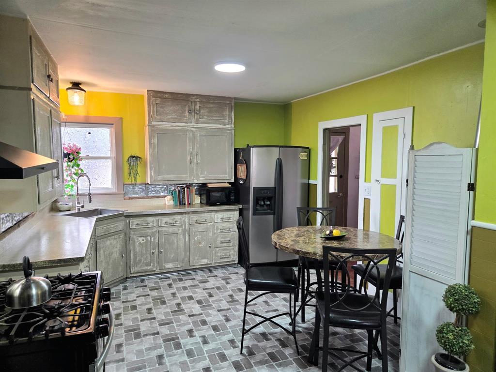 313 King Street Eden, TX 76837 - Photo 3 of 24 a kitchen with a table and chairs in it