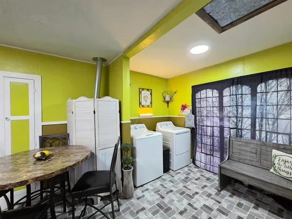 a workspace with furniture and window