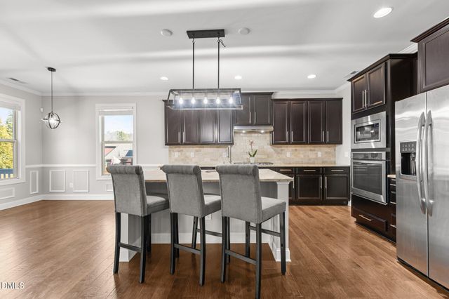a large kitchen with granite countertop lots of counter top space