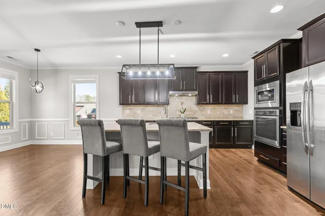 a large kitchen with granite countertop lots of counter top space