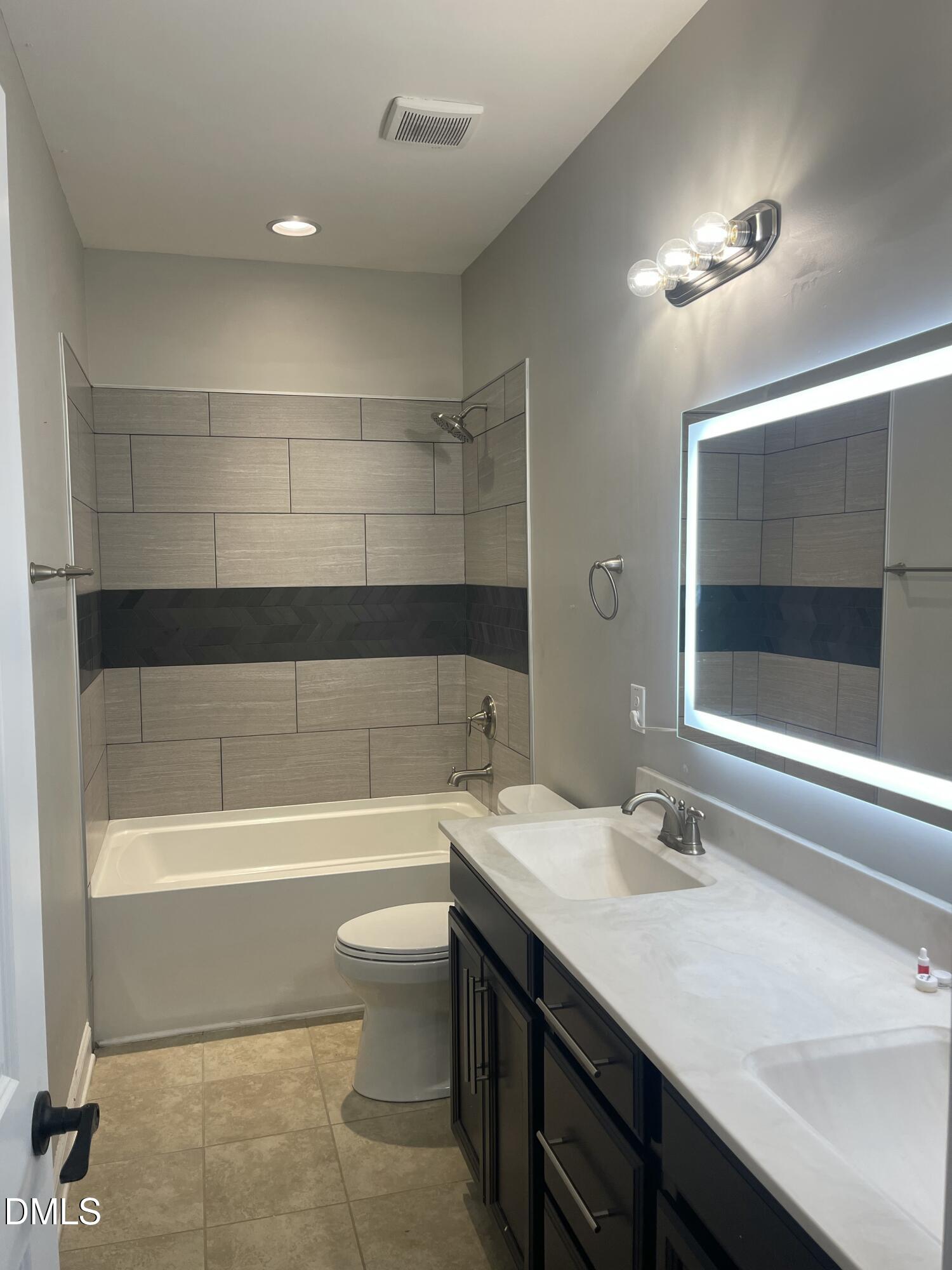 104 Highland Mist Circle Apex, NC 27539 - Photo 26 of 49 a bathroom with a sink a toilet and shower