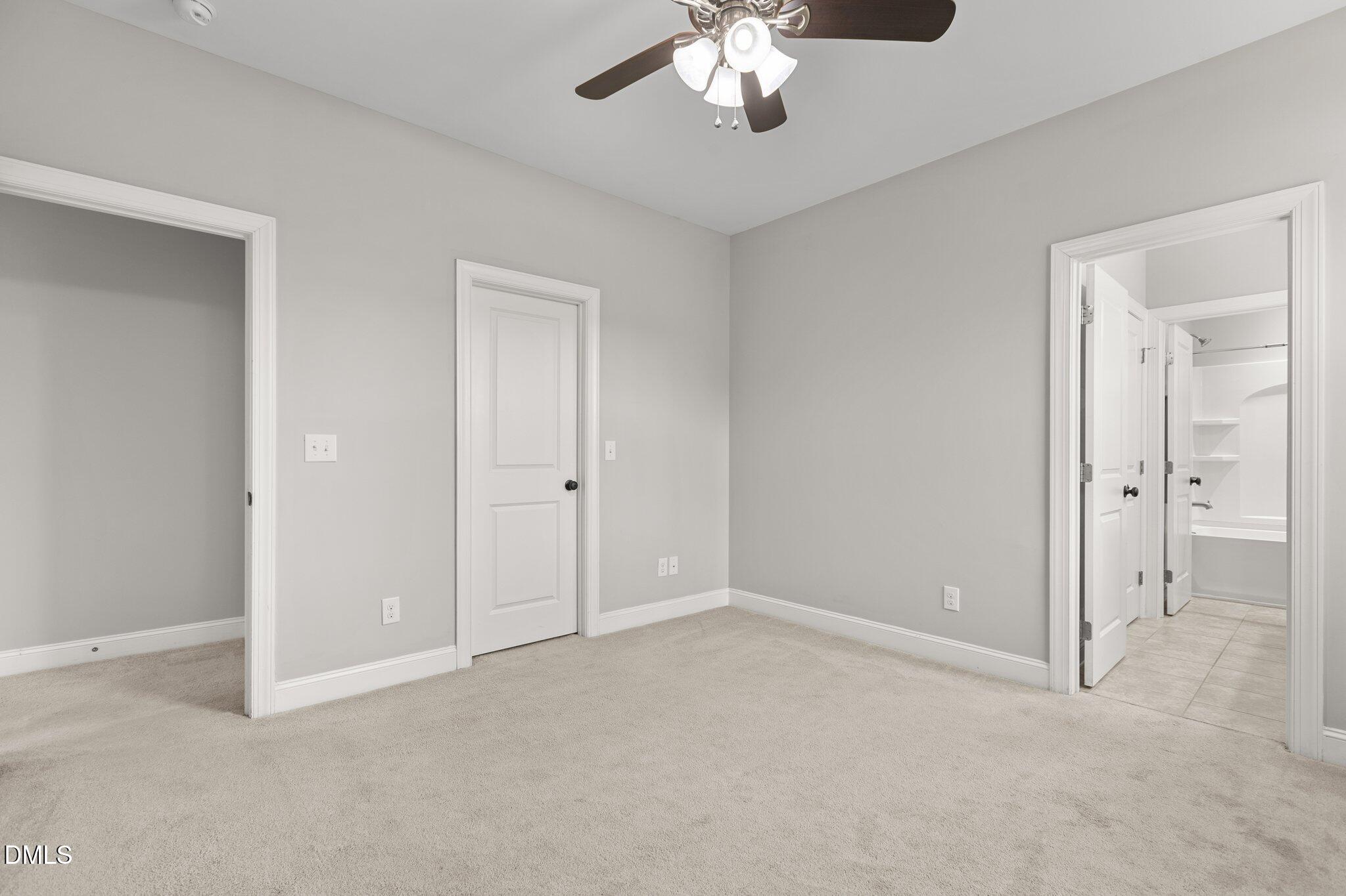 104 Highland Mist Circle Apex, NC 27539 - Photo 28 of 49 a view of an empty room with a chandelier fan
