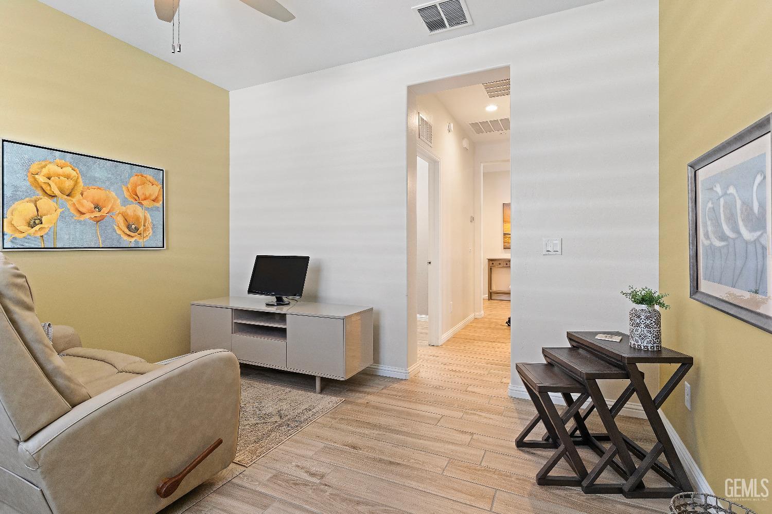 Undisclosed Address Bakersfield, CA 93311 - Photo 14 of 25 a living room with furniture and a wooden floor