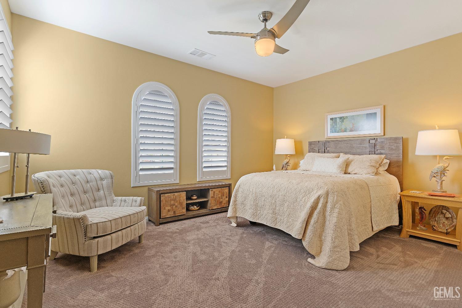 Undisclosed Address Bakersfield, CA 93311 - Photo 16 of 25 a spacious bedroom with a bed and a couch