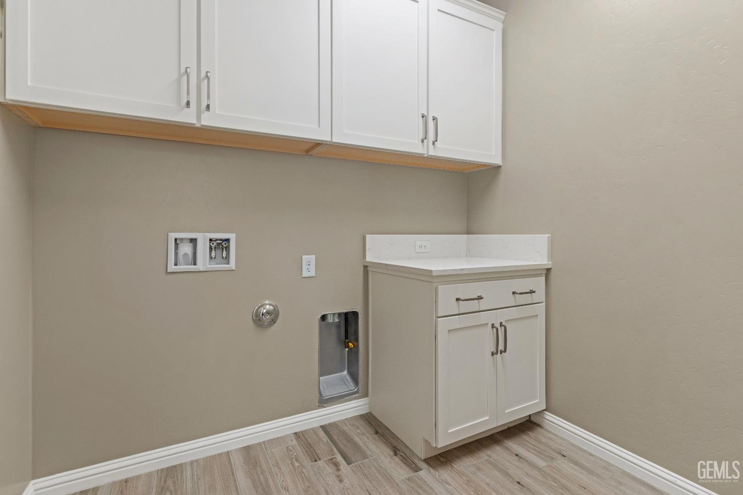 Undisclosed Address Bakersfield, CA 93311 - Photo 20 of 25 a view of cabinets and wooden floor