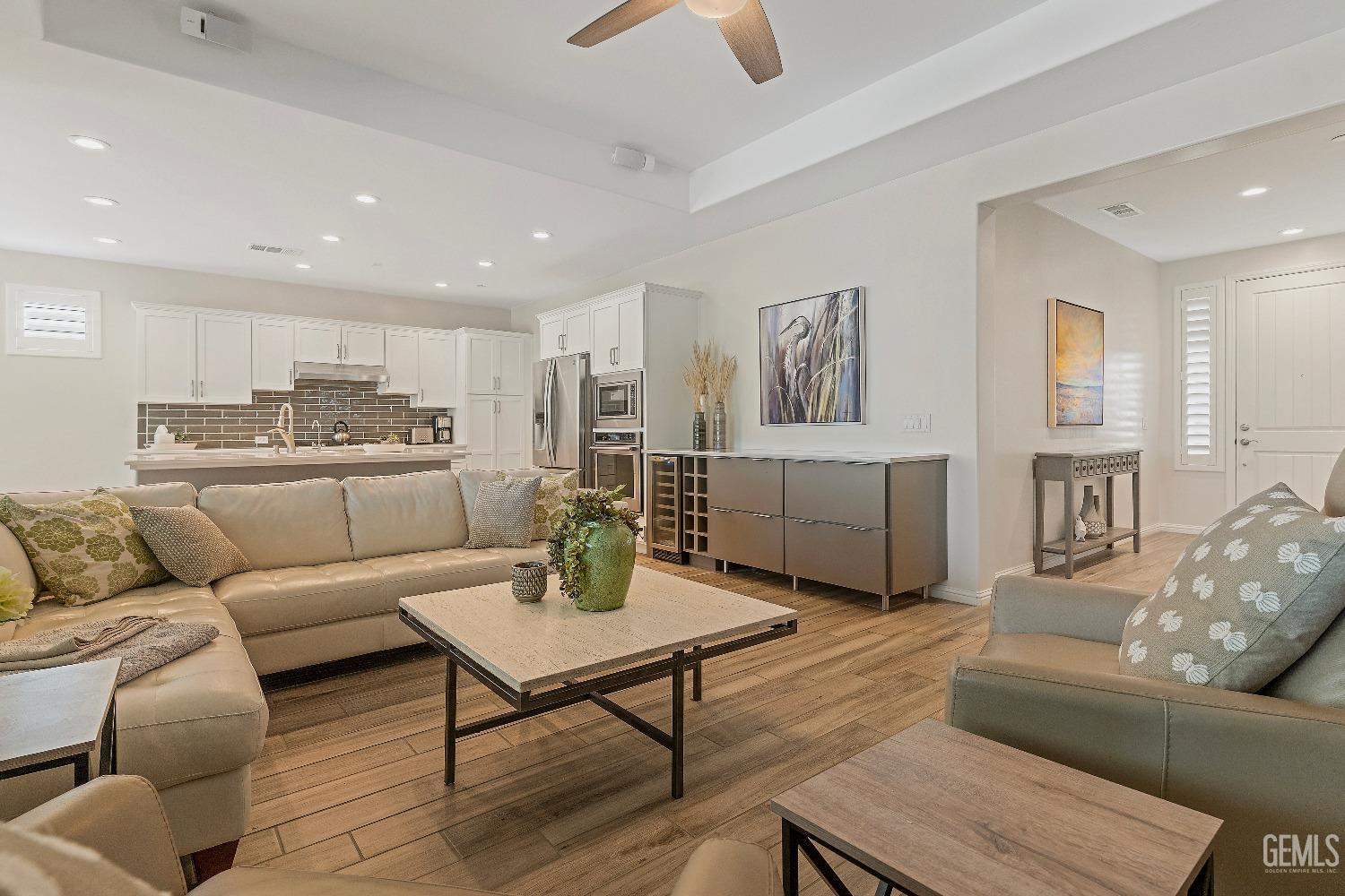 Undisclosed Address Bakersfield, CA 93311 - Photo 2 of 25 a living room with furniture and a view of kitchen