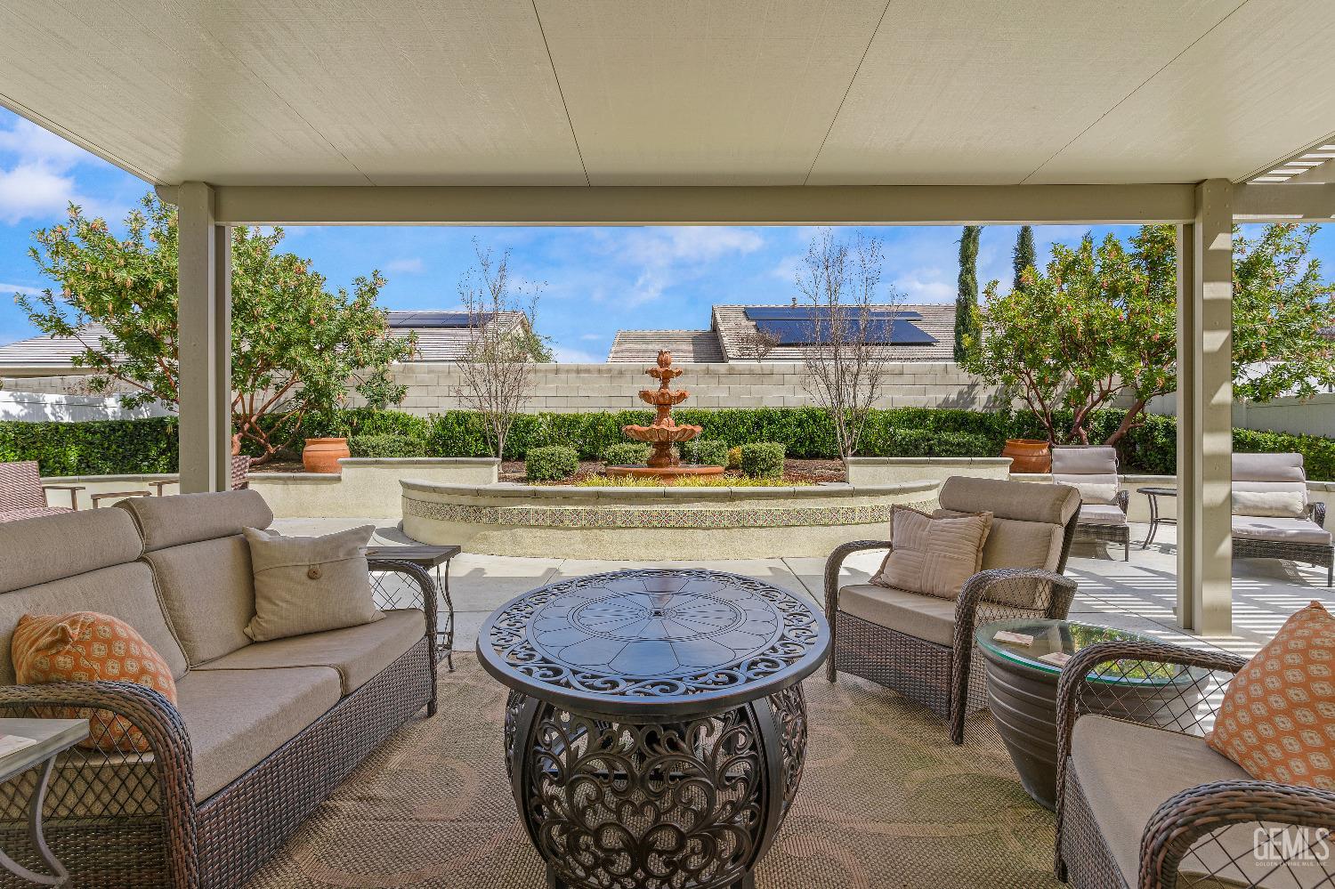 Undisclosed Address Bakersfield, CA 93311 - Photo 23 of 25 a living room with patio furniture and a floor to ceiling window