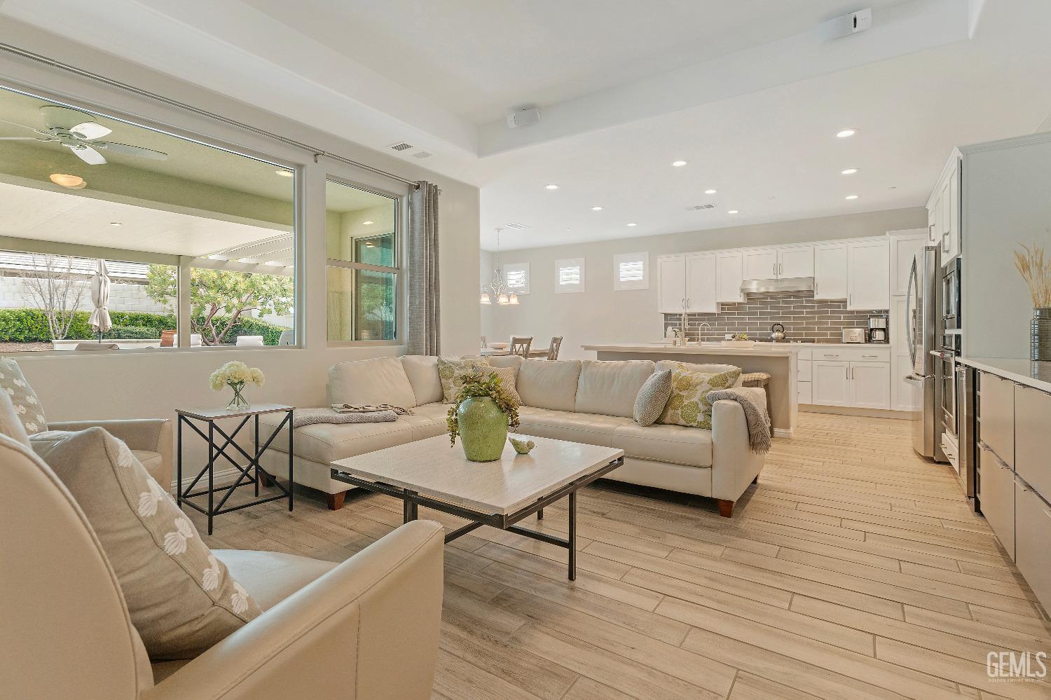 Undisclosed Address Bakersfield, CA 93311 - Photo 3 of 25 a living room with furniture wooden floor and a large window