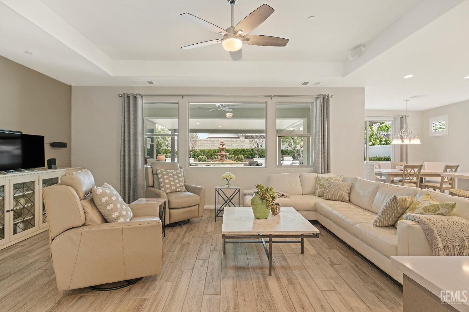 Undisclosed Address Bakersfield, CA 93311 - Photo 4 of 25 a living room with furniture and a flat screen tv