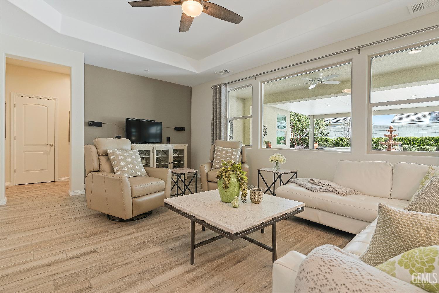 Undisclosed Address Bakersfield, CA 93311 - Photo 5 of 25 a living room with furniture and a flat screen tv