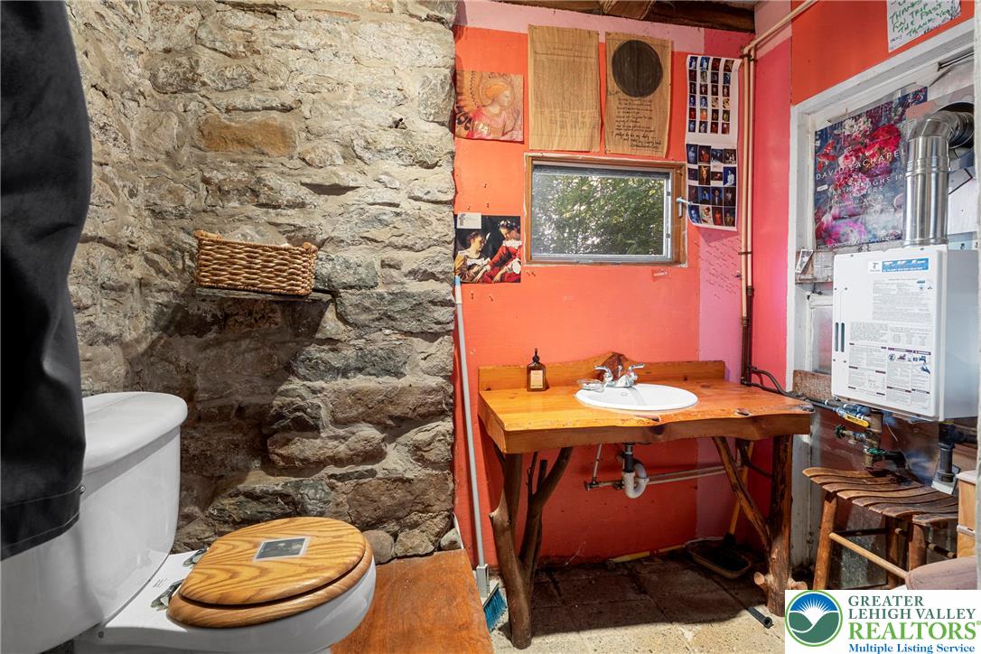 Eo Little Creek Road Bangor, PA 18013 - Photo 19 of 57 a bathroom with a toilet a sink and mirror