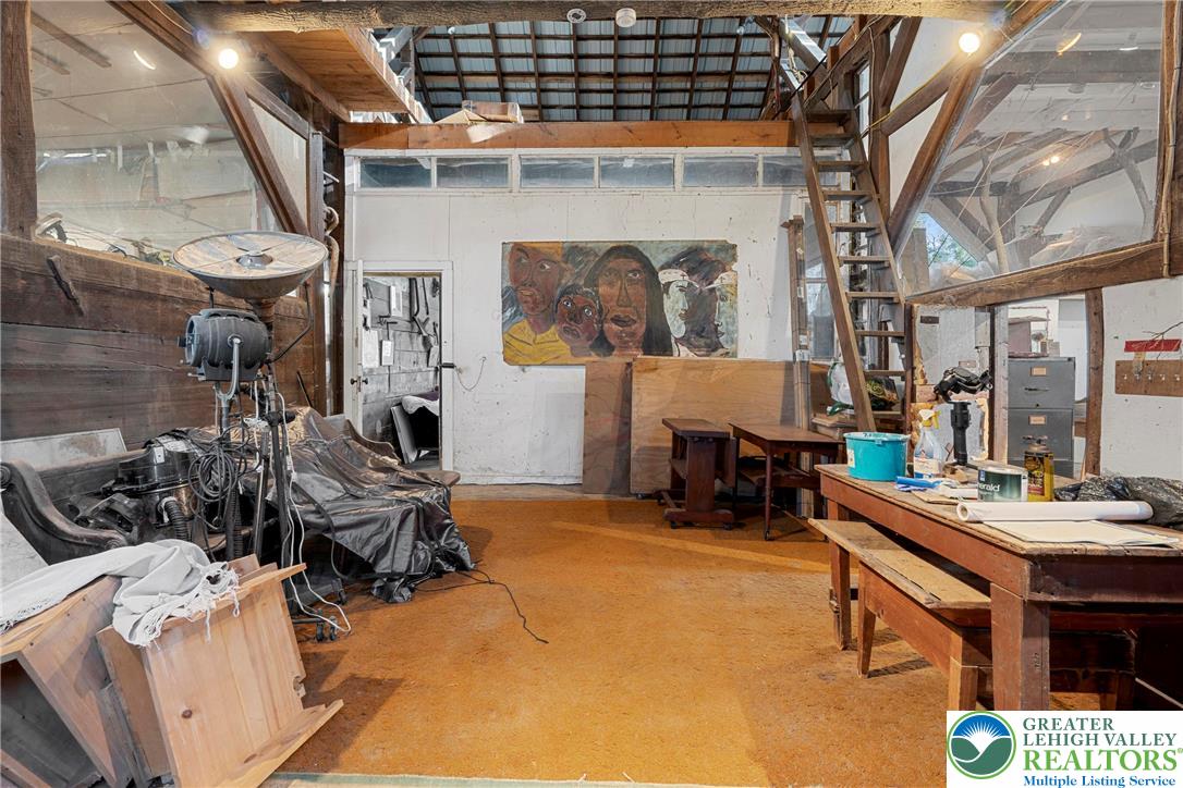 Eo Little Creek Road Bangor, PA 18013 - Photo 22 of 57 a room filled with furniture and a chandelier