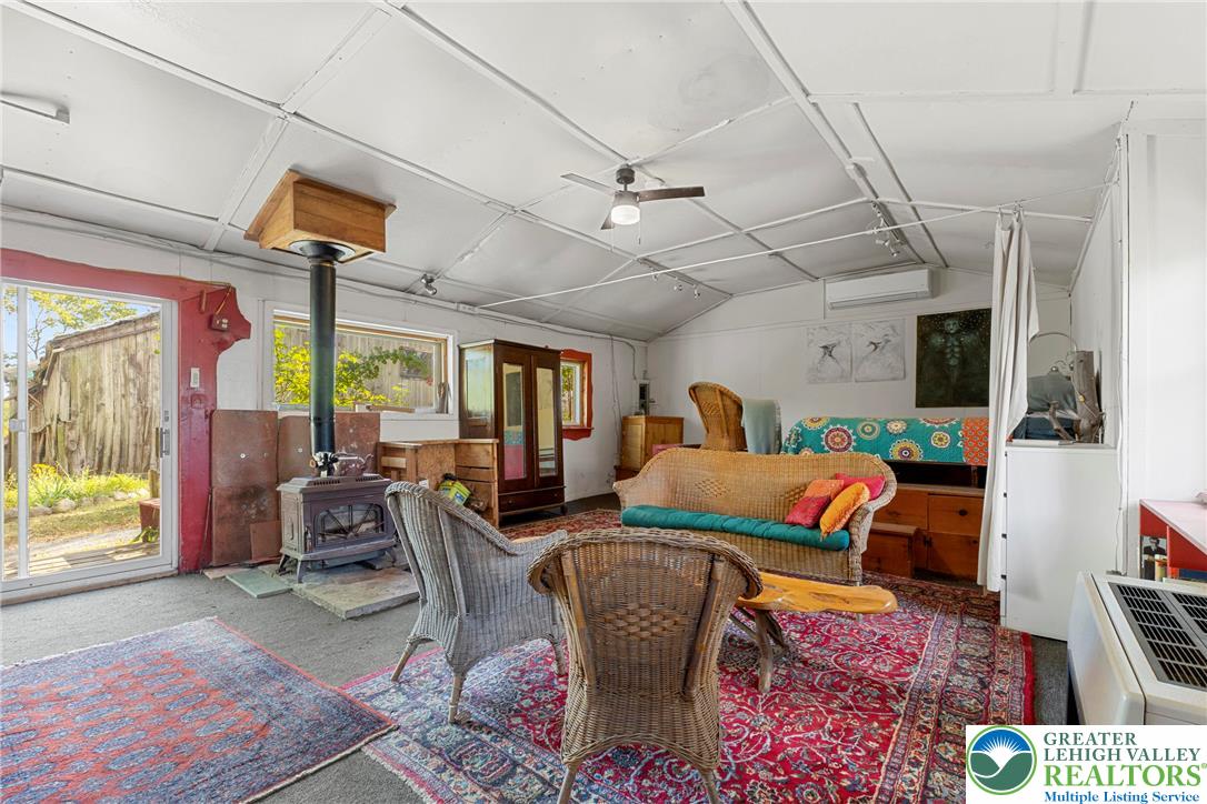 Eo Little Creek Road Bangor, PA 18013 - Photo 31 of 57 a living room with lots of furniture and a chandelier