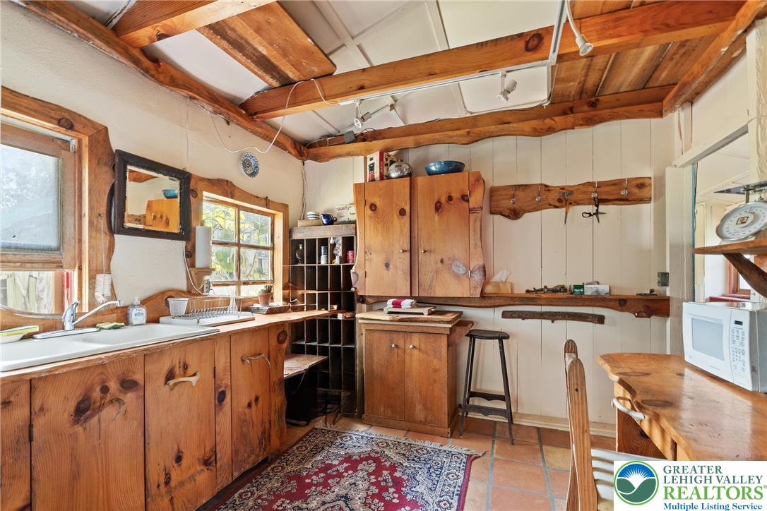 Eo Little Creek Road Bangor, PA 18013 - Photo 32 of 57 a kitchen with a sink stove and cabinets
