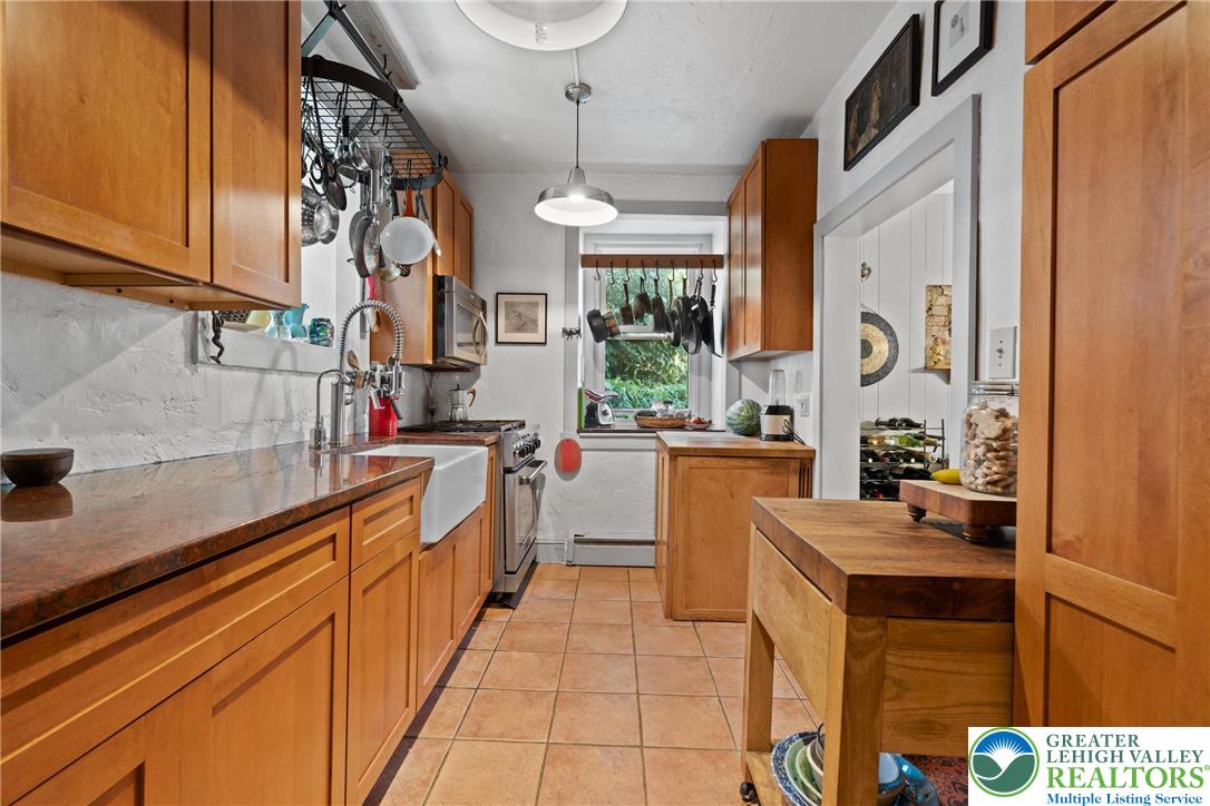 Eo Little Creek Road Bangor, PA 18013 - Photo 7 of 57 a kitchen with stainless steel appliances granite countertop a sink and cabinets
