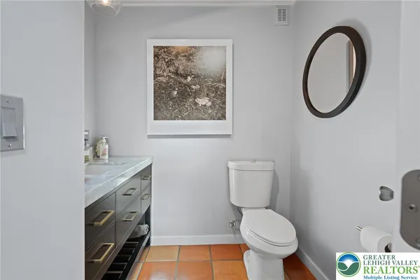 a spacious bathroom with a bathtub sink and window