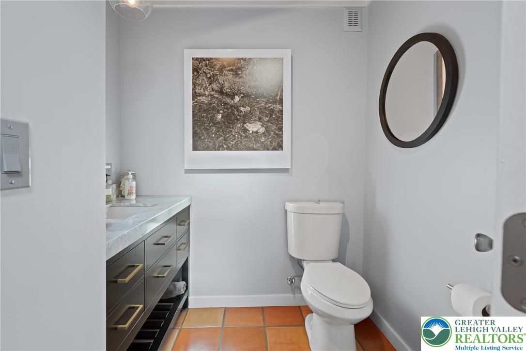 Eo Little Creek Road Bangor, PA 18013 - Photo 8 of 57 a bathroom with a toilet a sink and a mirror