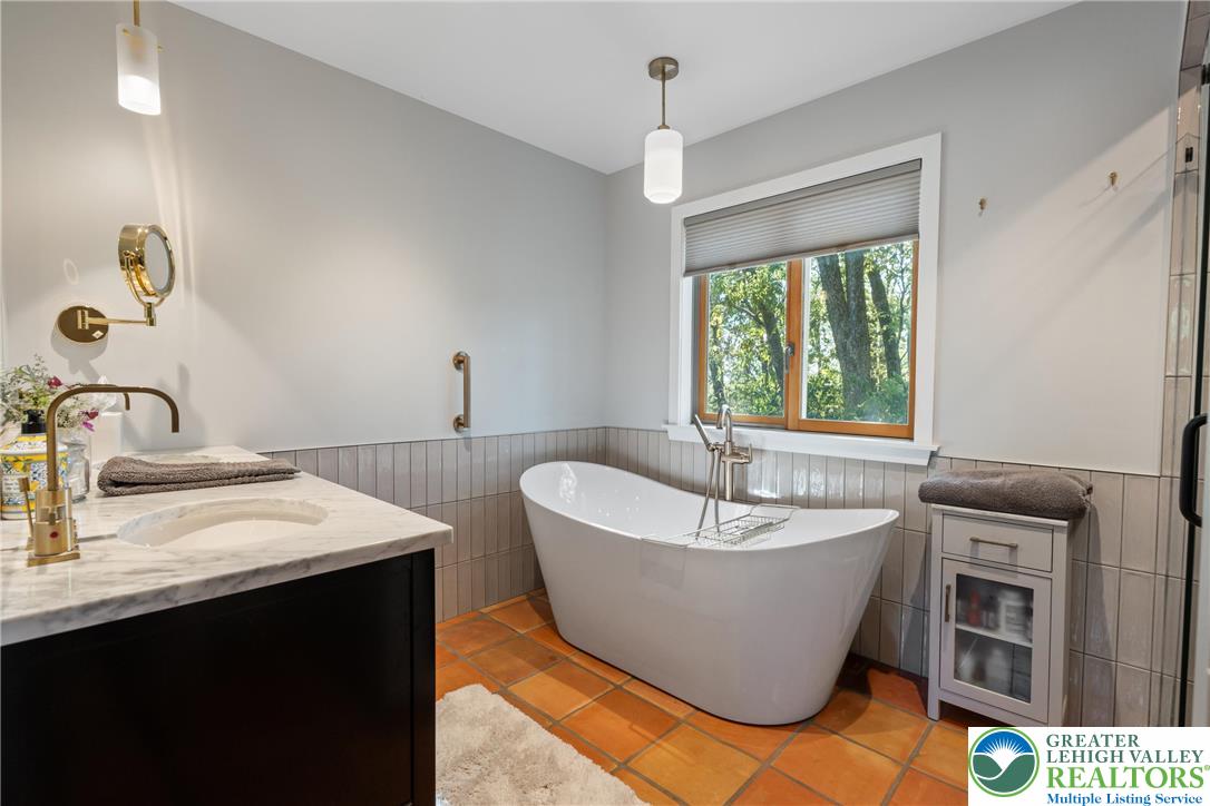 Eo Little Creek Road Bangor, PA 18013 - Photo 10 of 57 a spacious bathroom with a bathtub sink and window