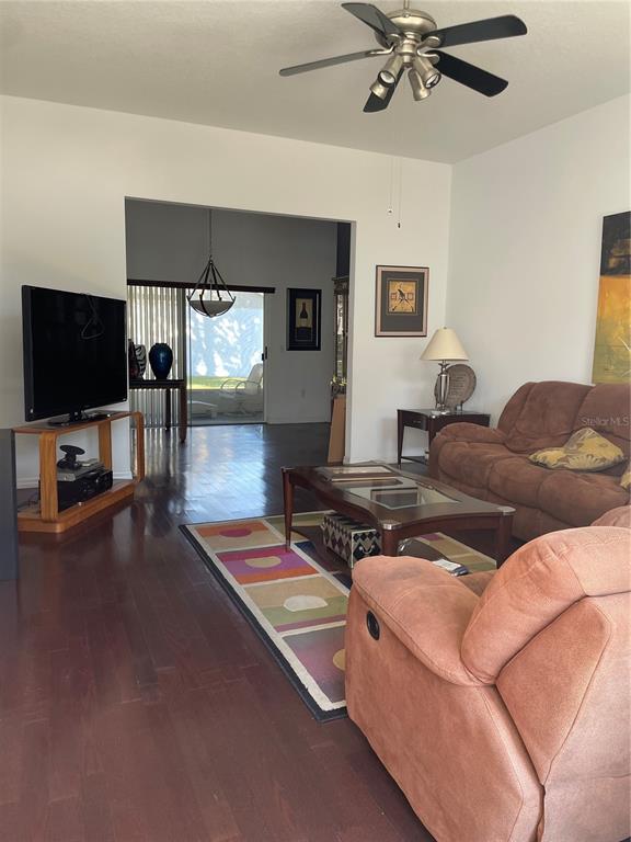 9311 Villa Entrada New Port Richey, FL 34655 - Photo 13 of 16 a living room with furniture and a flat screen tv