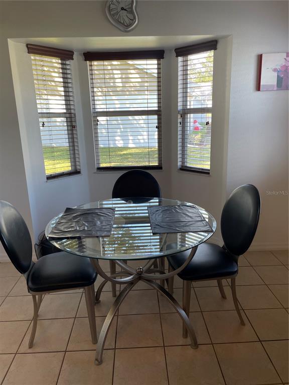 9311 Villa Entrada New Port Richey, FL 34655 - Photo 5 of 16 a view of a workspace with furniture