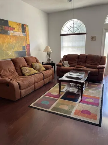 a view of an empty room with a chandelier
