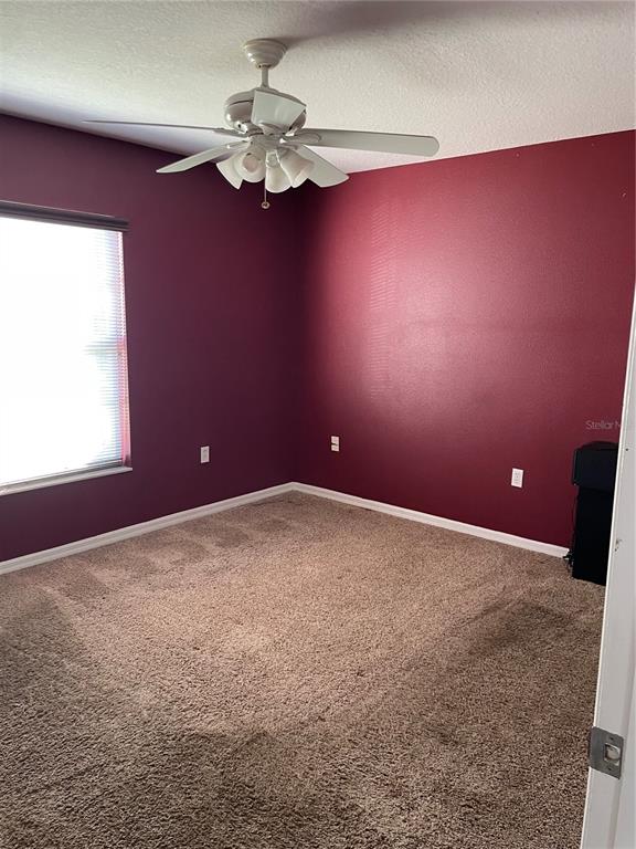 9311 Villa Entrada New Port Richey, FL 34655 - Photo 8 of 16 a view of an empty room with a chandelier